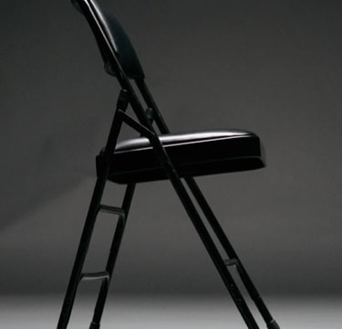 Picture of a black chair on its side.